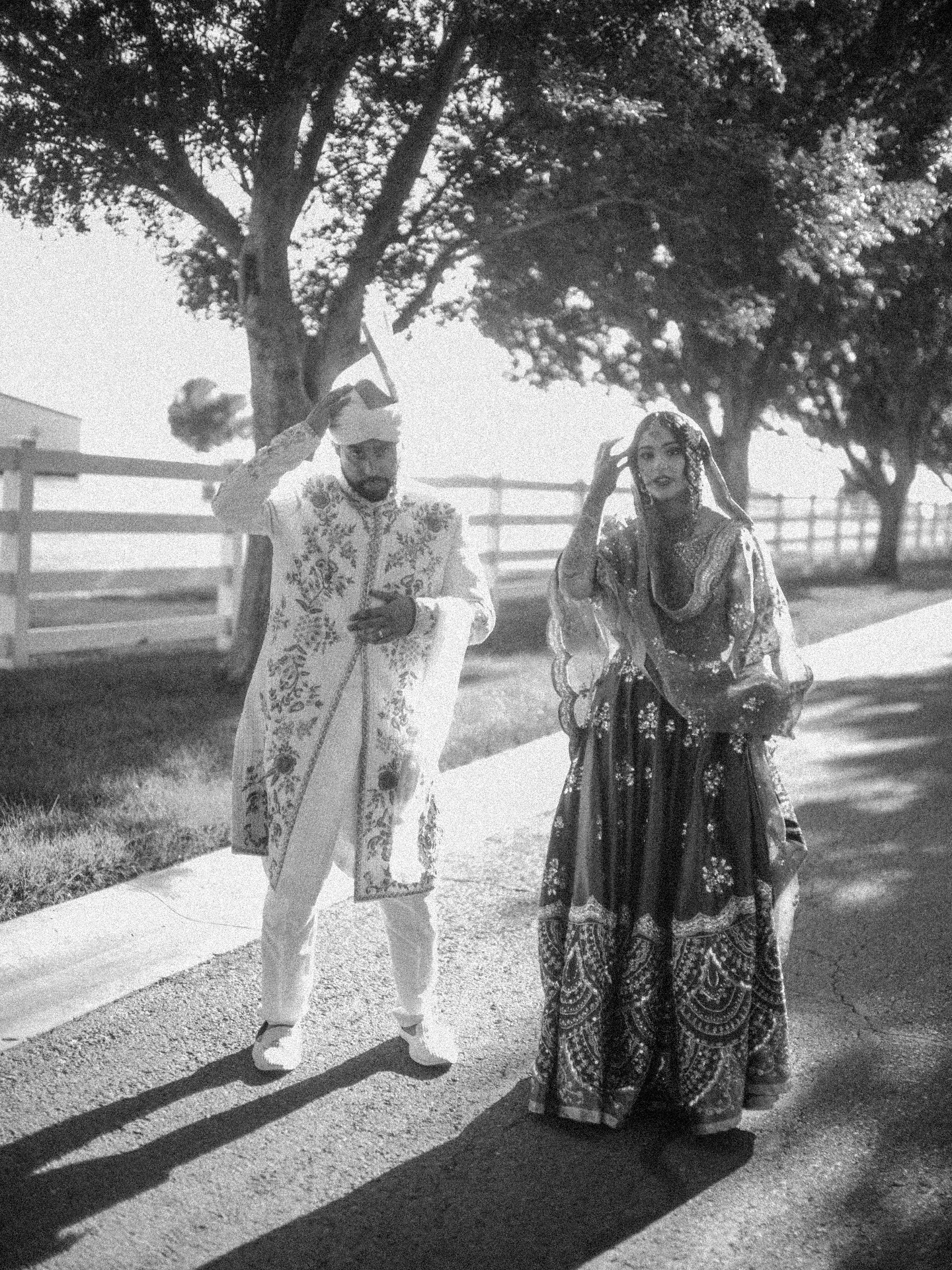 Bride and groom in traditional attire, black and white